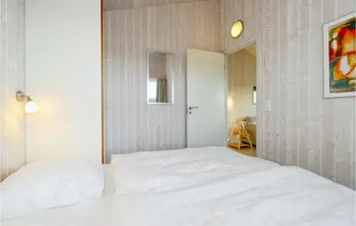 Ein Bett oder Betten in einem Zimmer der Unterkunft Friedrichskoog-Strandpark 9