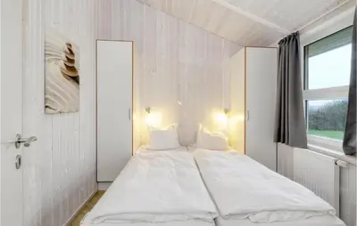 Ein Bett oder Betten in einem Zimmer der Unterkunft Friedrichskoog-Strandpark 17