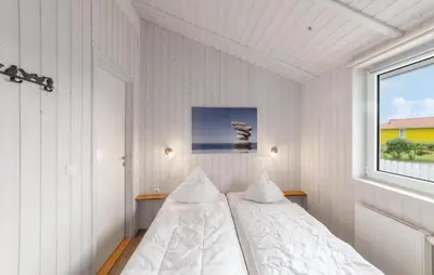 Ein Bett oder Betten in einem Zimmer der Unterkunft Friedrichskoog-Deichblick 4