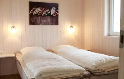 Ein Bett oder Betten in einem Zimmer der Unterkunft Friedrichskoog-Deichblick 5
