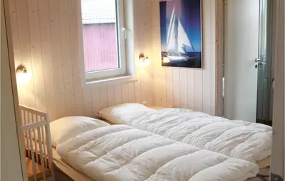 Ein Bett oder Betten in einem Zimmer der Unterkunft Friedrichskoog-Deichblick 7