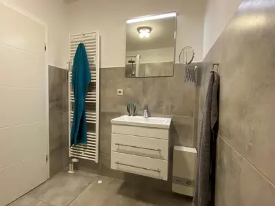 Ein Badezimmer in der Unterkunft Oasis 10