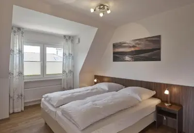 Ein Bett oder Betten in einem Zimmer der Unterkunft Op de Geest 13
