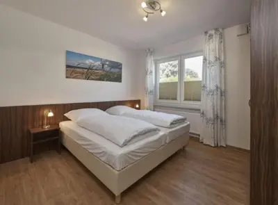 Ein Bett oder Betten in einem Zimmer der Unterkunft Op de Geest 01
