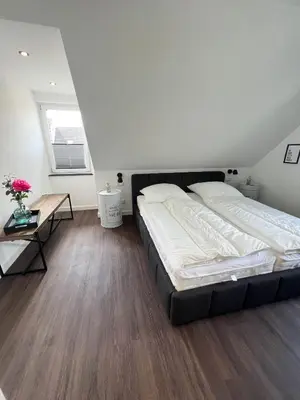 Ein Bett oder Betten in einem Zimmer der Unterkunft Dyke Appartements