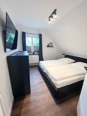 Ein Bett oder Betten in einem Zimmer der Unterkunft Dyke Appartements