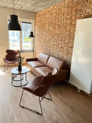 Ein Sitzbereich in der Unterkunft Dyke Appartements