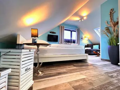 Ein Bett oder Betten in einem Zimmer der Unterkunft Sanibel Island -by Mila FerienARPartments- Büsum Zentrum eigener Parkplatz