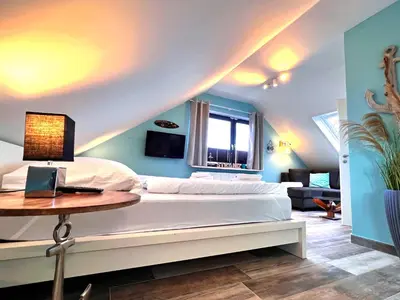 Ein Bett oder Betten in einem Zimmer der Unterkunft Sanibel Island -by Mila FerienARPartments- Büsum Zentrum eigener Parkplatz