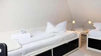 Ein Bett oder Betten in einem Zimmer der Unterkunft strandnahe Ferienwohnung mit zwei sep. Schlafzimmern