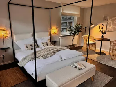 Ein Bett oder Betten in einem Zimmer der Unterkunft Seaside Rooms - Design-Apartment mit Balkon & Parkplatz - inklusive Strandkorb direkt am Wasser und Spa & Sauna saisonal
