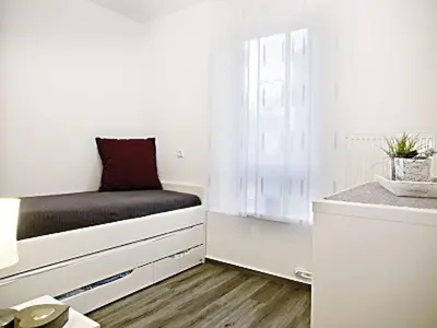 Ein Bett oder Betten in einem Zimmer der Unterkunft Residenz Rugenbarg, Whg A3