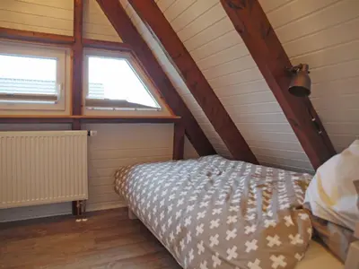 Ein Bett oder Betten in einem Zimmer der Unterkunft Haus Pelle