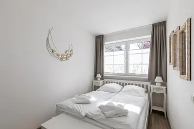 Ein Bett oder Betten in einem Zimmer der Unterkunft Haus Weisse Möwe, Whg 2