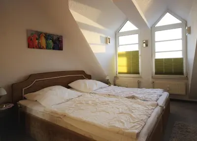 Ein Bett oder Betten in einem Zimmer der Unterkunft Haus Elbe 1, Whg 38