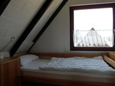 Ein Bett oder Betten in einem Zimmer der Unterkunft Nordstern