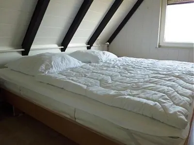 Ein Bett oder Betten in einem Zimmer der Unterkunft Nordstern