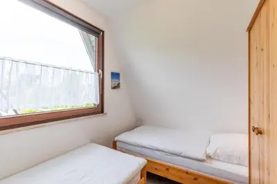 Ein Bett oder Betten in einem Zimmer der Unterkunft Nordseewelle