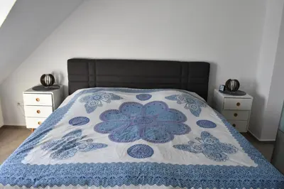 Ein Bett oder Betten in einem Zimmer der Unterkunft Wohnung 