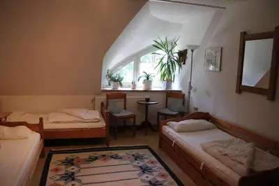 Ein Bett oder Betten in einem Zimmer der Unterkunft Erlenhof Steinau Fachwerkhaus mit Reetdach