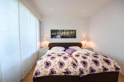 Ein Bett oder Betten in einem Zimmer der Unterkunft Haus 