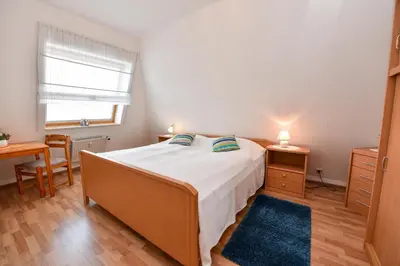Ein Bett oder Betten in einem Zimmer der Unterkunft Haus 