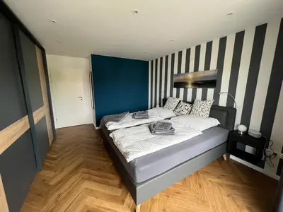 Ein Bett oder Betten in einem Zimmer der Unterkunft Deichsuite