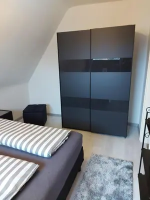 Ein Bett oder Betten in einem Zimmer der Unterkunft Ferienwohnung Strandnah