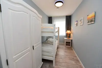 Ein Bett oder Betten in einem Zimmer der Unterkunft Haus 