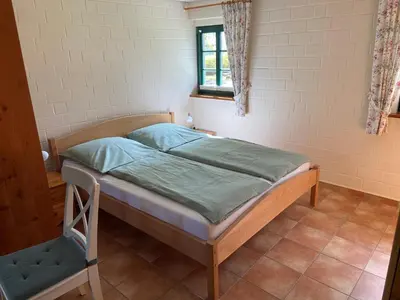 Ein Bett oder Betten in einem Zimmer der Unterkunft Ferienhaus Mangels