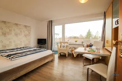 Ein Bett oder Betten in einem Zimmer der Unterkunft Haus Elbe Döse Wohnung 16