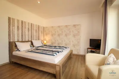 Ein Bett oder Betten in einem Zimmer der Unterkunft Haus Elbe Döse Wohnung 16
