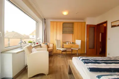 Ein Bett oder Betten in einem Zimmer der Unterkunft Haus Elbe Döse Wohnung 16