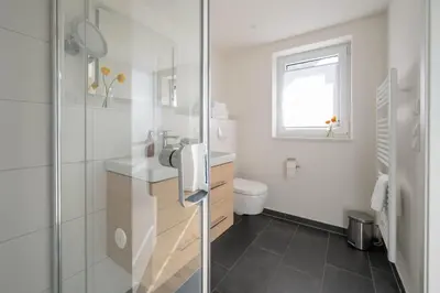 Ein Badezimmer in der Unterkunft Haus Lütt Schick Apartment Feenja