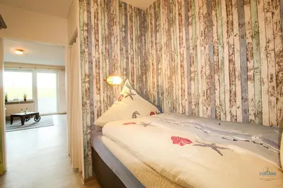 Ein Bett oder Betten in einem Zimmer der Unterkunft Haus Nautic Döse Wohnung 123