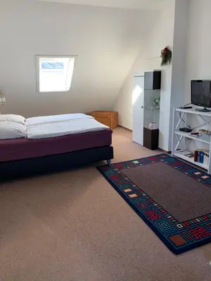 Ein Bett oder Betten in einem Zimmer der Unterkunft Rosengarten 307