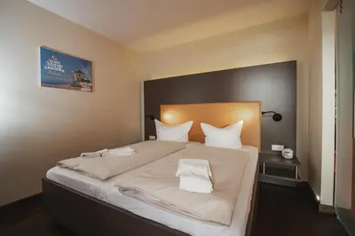 Ein Bett oder Betten in einem Zimmer der Unterkunft Resort Deichgraf Resort Deichgraf 27-07