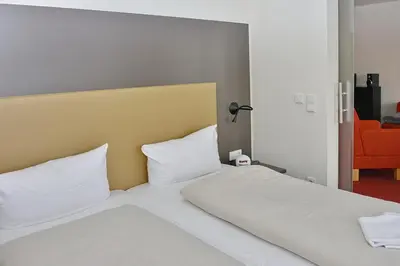 Ein Bett oder Betten in einem Zimmer der Unterkunft Resort Deichgraf Resort Deichgraf 27-03