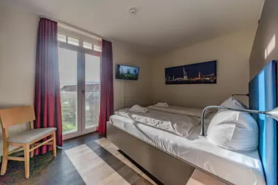 Ein Bett oder Betten in einem Zimmer der Unterkunft Resort Deichgraf Resort Deichgraf 27-08