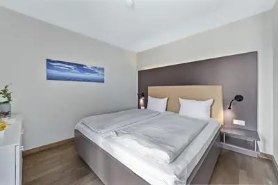 Ein Bett oder Betten in einem Zimmer der Unterkunft Resort Deichgraf Resort Deichgraf 27-13