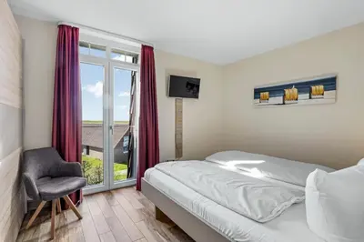 Ein Bett oder Betten in einem Zimmer der Unterkunft Resort Deichgraf Resort Deichgraf 27-14