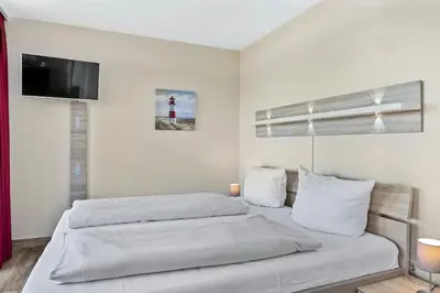 Ein Bett oder Betten in einem Zimmer der Unterkunft Resort Deichgraf Resort Deichgraf 27-14