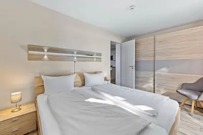 Ein Bett oder Betten in einem Zimmer der Unterkunft Resort Deichgraf Resort Deichgraf 27-14