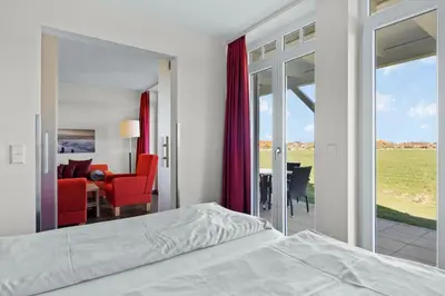 Ein Bett oder Betten in einem Zimmer der Unterkunft Resort Deichgraf Resort Deichgraf 31-03