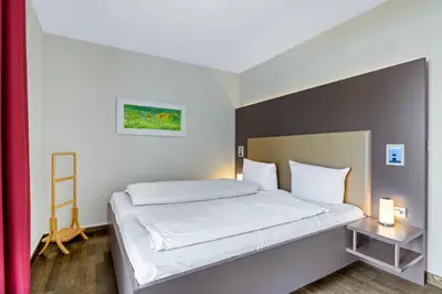 Ein Bett oder Betten in einem Zimmer der Unterkunft Resort Deichgraf Resort Deichgraf 31-08