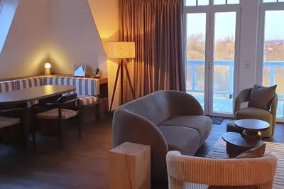 Ein Sitzbereich in der Unterkunft Resort Deichgraf Resort Deichgraf 31-18