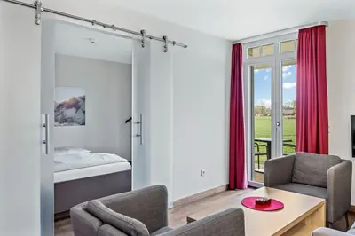 Ein Bett oder Betten in einem Zimmer der Unterkunft Resort Deichgraf Resort Deichgraf 31-05