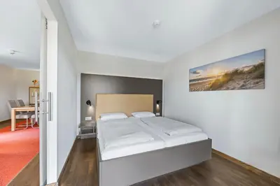 Ein Bett oder Betten in einem Zimmer der Unterkunft Resort Deichgraf Resort Deichgraf 31-02