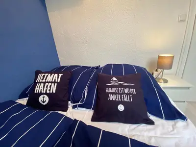 Ein Bett oder Betten in einem Zimmer der Unterkunft Heimathafen Friedrichskoog