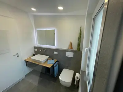 Ein Badezimmer in der Unterkunft Luv-Moderne Neubauwohnung in Strandnähe-Wallbox